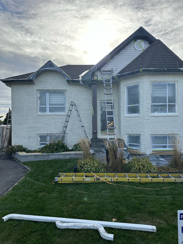 Professional spray painted home exterior in Alberta